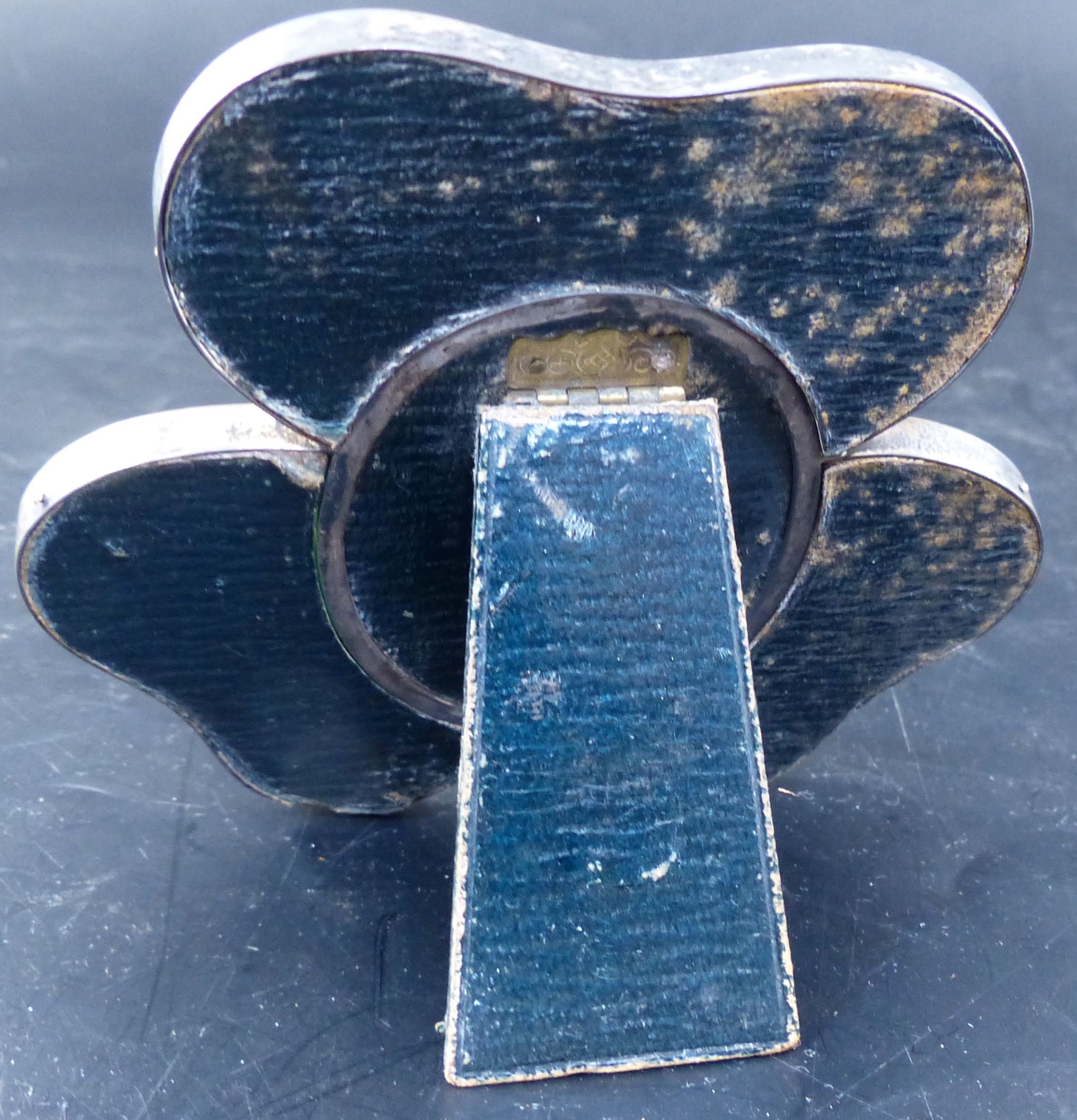A late Victorian silver and green enamel mounted shamrock photograph frame, 97mm.